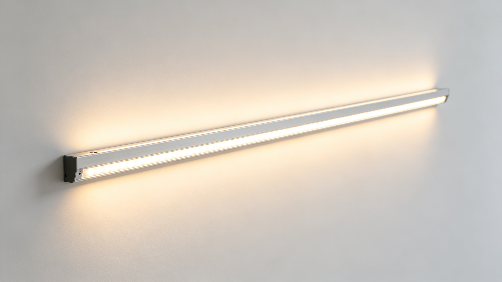 Even soft wall-wash light from a dot-free LED strip in an aluminium channel on a white wall