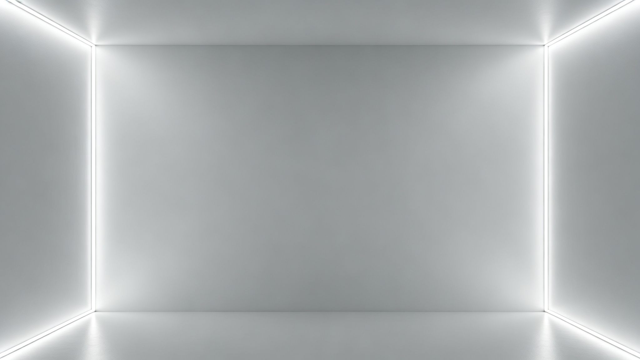 Plain light-grey room with LED strip at both corners casting even consistent light