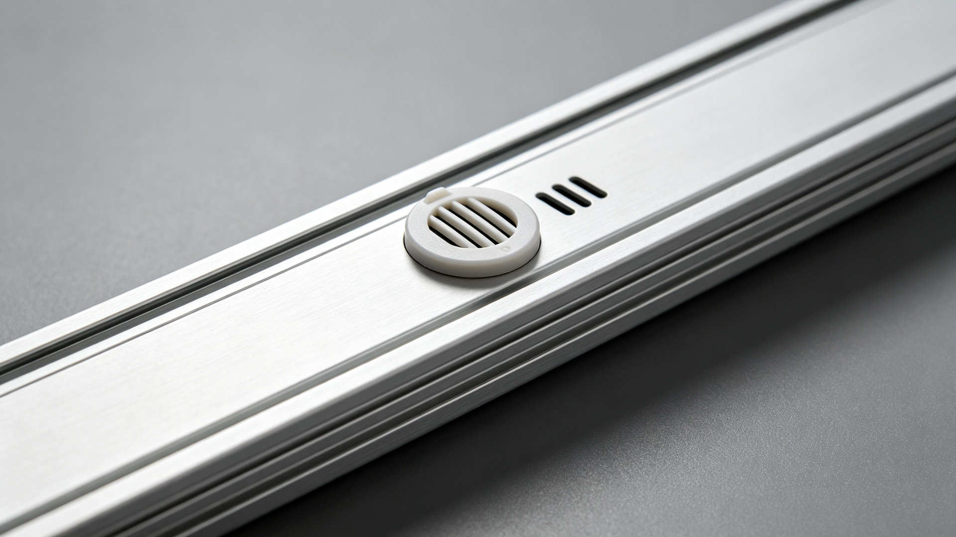 Close-up of a vented breather valve on an outdoor LED strip aluminum housing