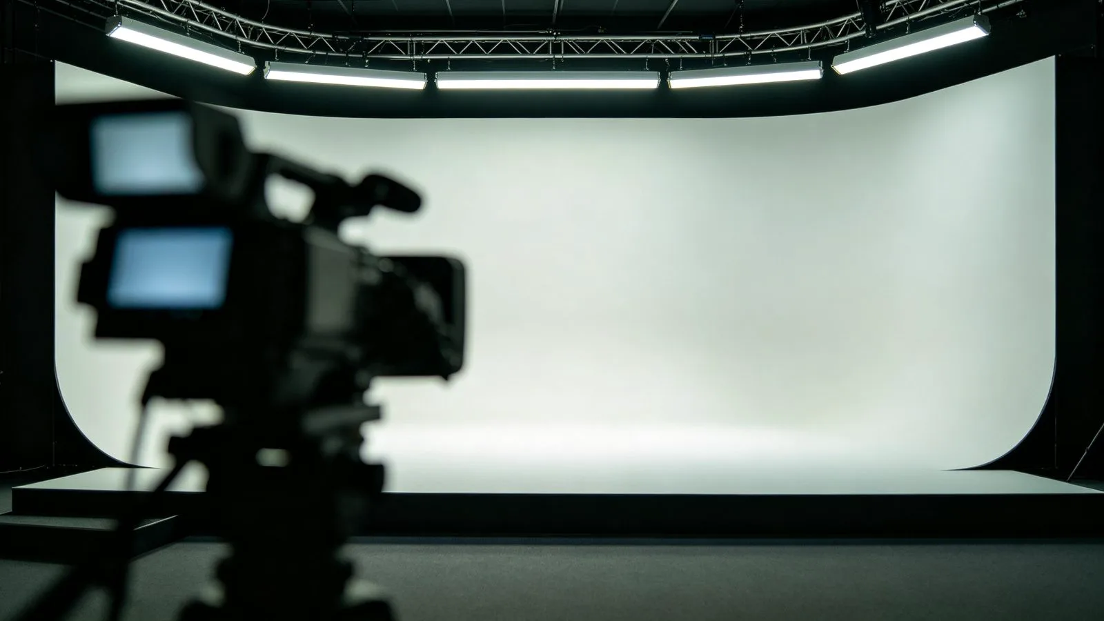 Television studio set illuminated by high-CRI tunable LED strip lighting with cameras
